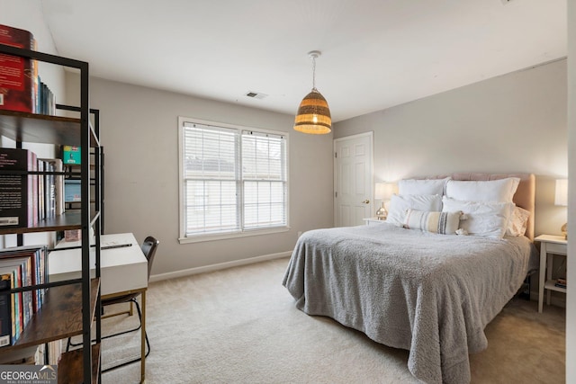 carpeted bedroom with baseboards and visible vents