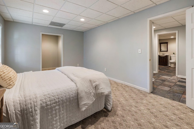 bedroom featuring dark colored carpet, recessed lighting, a paneled ceiling, and baseboards