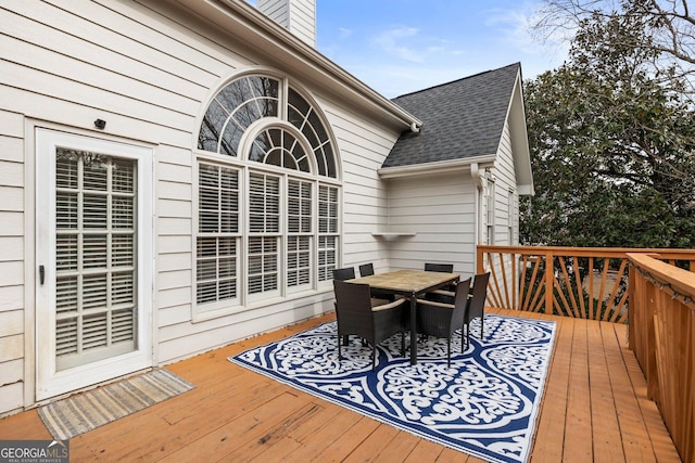 wooden deck featuring outdoor dining space