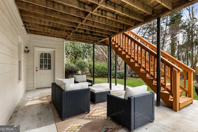 view of patio / terrace featuring stairway and an outdoor hangout area