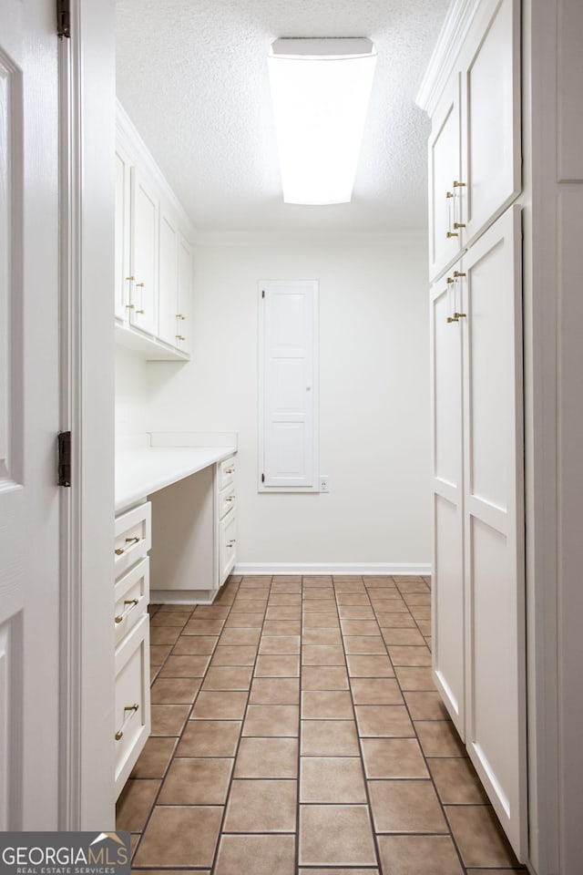 702 Hillmont Dr, Waycross, GA 31503 - laundry area with a textured ceiling and light tile patterned flooring