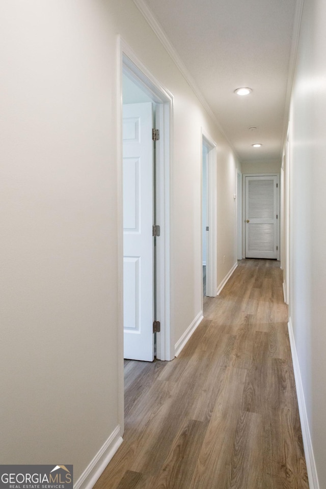 702 Hillmont Dr, Waycross, GA 31503 - hall featuring wood finished floors, ornamental molding, and recessed lighting