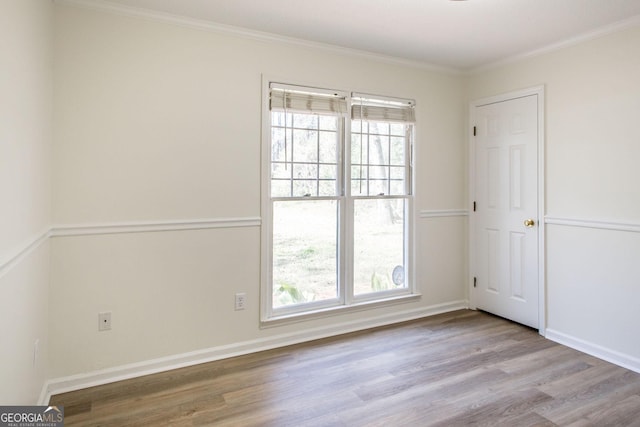 702 Hillmont Dr, Waycross, GA 31503 - unfurnished room with wood finished floors, healthy amount of natural light, and crown molding