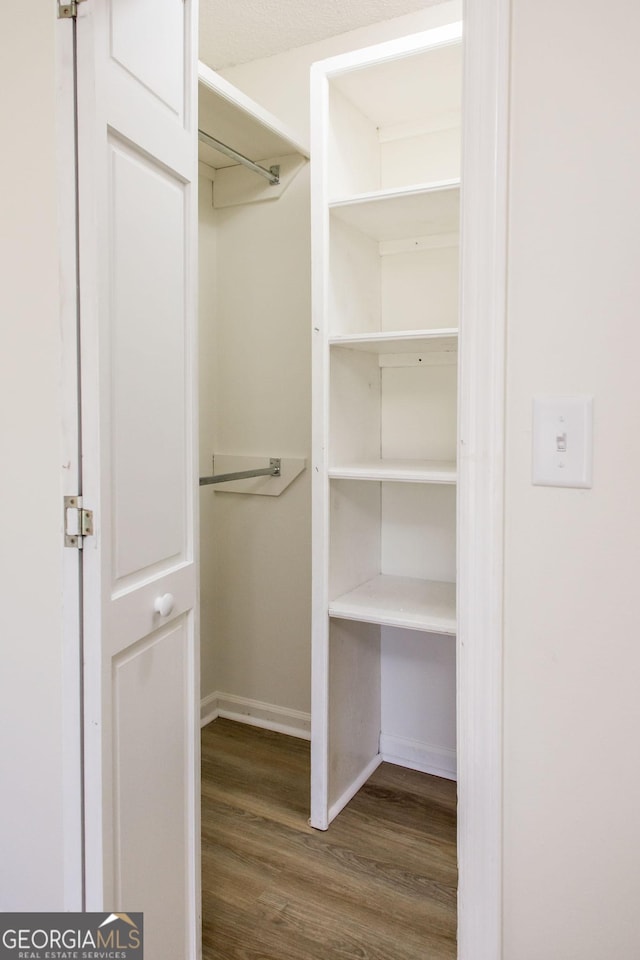 702 Hillmont Dr, Waycross, GA 31503 - spacious closet featuring wood finished floors