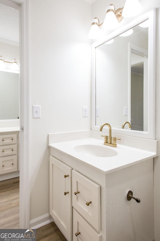 702 Hillmont Dr, Waycross, GA 31503 - bathroom with vanity and wood finished floors