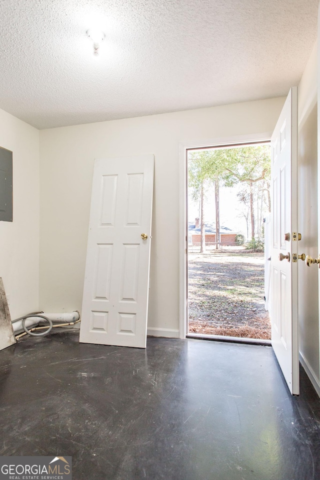 702 Hillmont Dr, Waycross, GA 31503 - entrance foyer featuring a textured ceiling and concrete floors