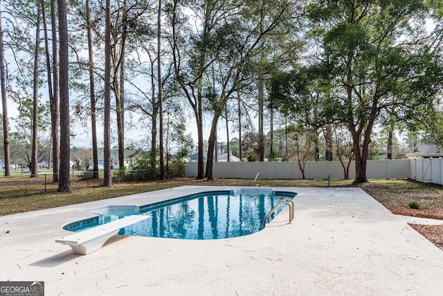 702 Hillmont Dr, Waycross, GA 31503 - view of swimming pool featuring a fenced backyard, a patio, and a diving board