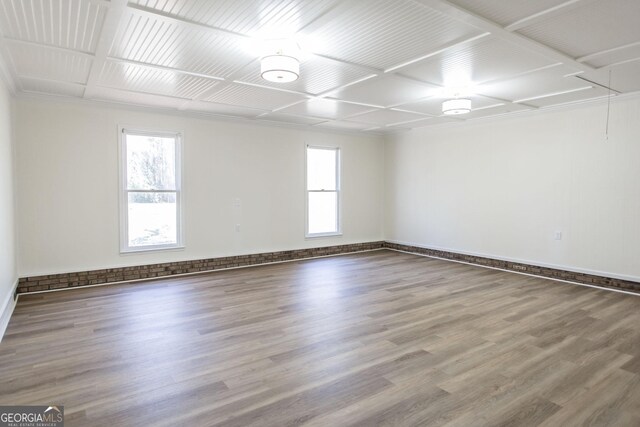 702 Hillmont Dr, Waycross, GA 31503 - unfurnished room featuring coffered ceiling and wood finished floors