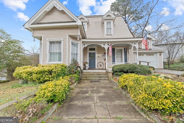 view of front of home featuring a garage and a porch