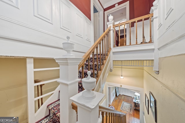 staircase featuring hardwood / wood-style flooring