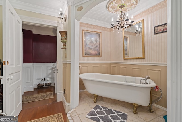 bathroom featuring a washtub and ornamental molding