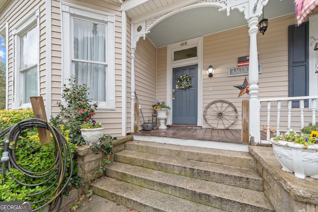 doorway to property featuring covered porch