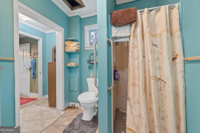 bathroom with toilet, crown molding, and a shower with curtain