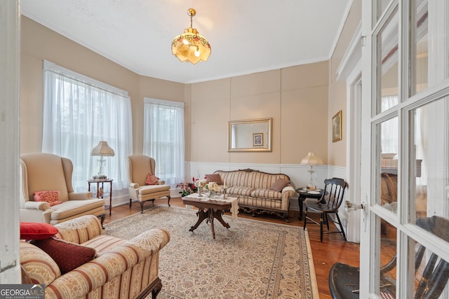 interior space featuring hardwood / wood-style floors and ornamental molding