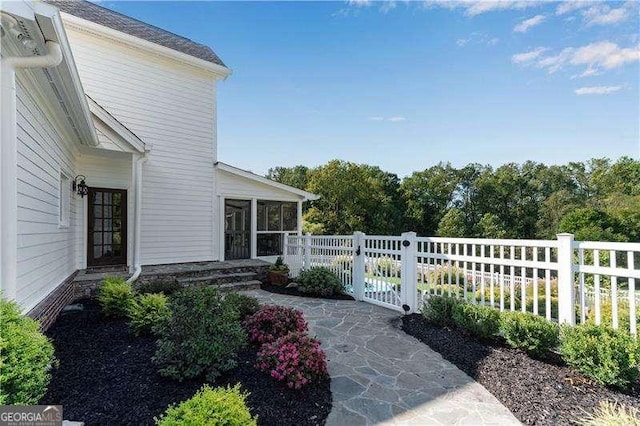 exterior space featuring a sunroom