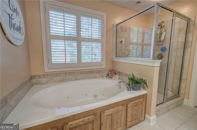 bathroom featuring shower with separate bathtub and tile patterned floors