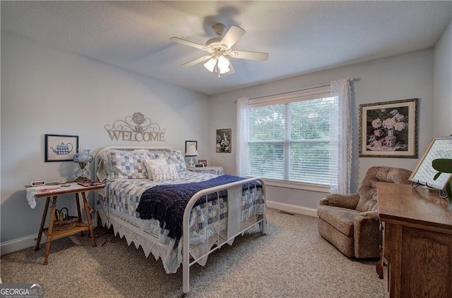 bedroom with light carpet and ceiling fan