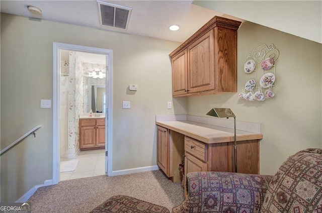 kitchen featuring light colored carpet