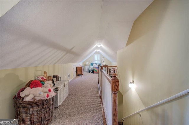 additional living space with carpet and lofted ceiling