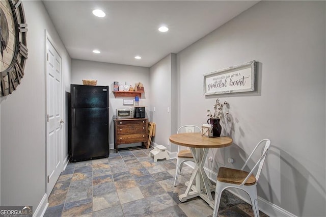 kitchen featuring black fridge