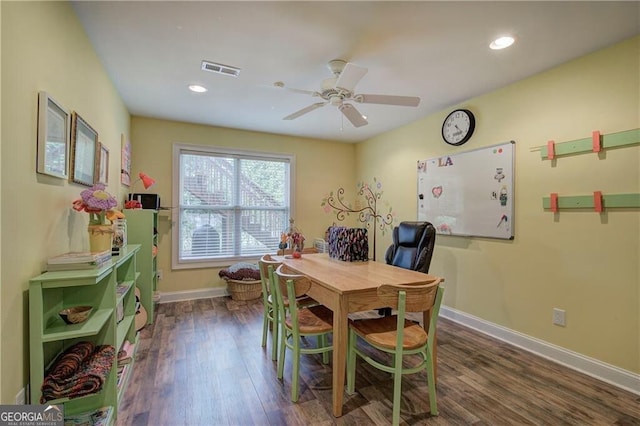 dining room with ceiling fan and dark hardwood / wood-style floors