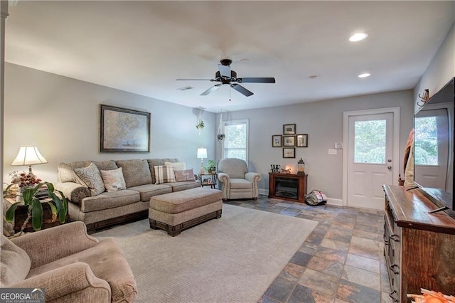 living room with ceiling fan