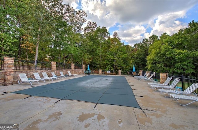 view of pool featuring a patio area