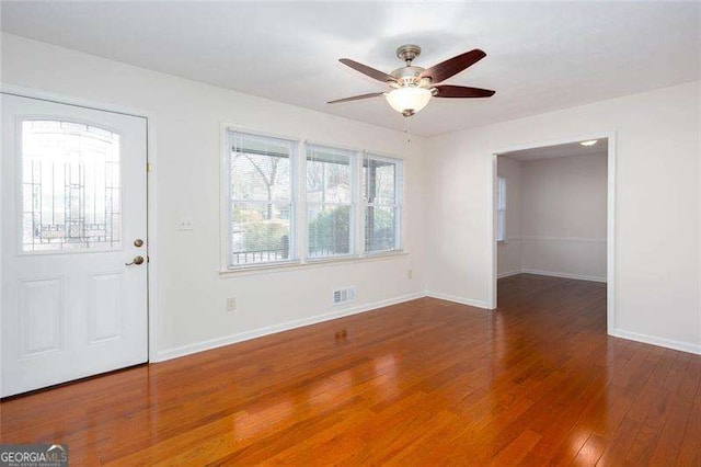 entrance foyer featuring ceiling fan and dark wood-type flooring