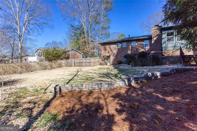 view of yard with a wooden deck