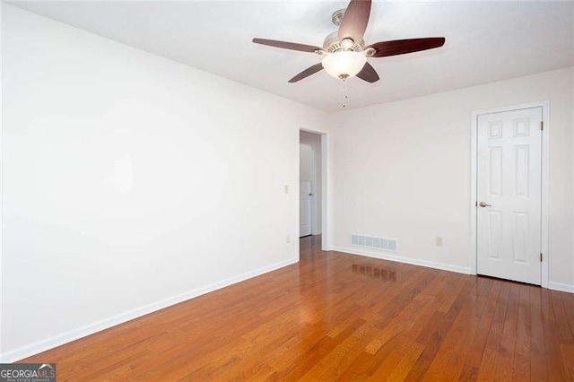 spare room featuring ceiling fan and wood-type flooring