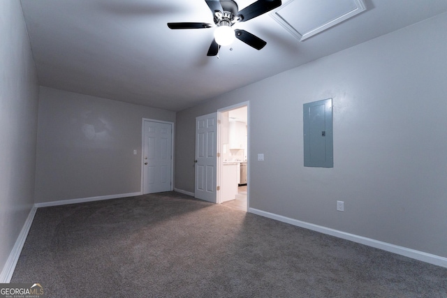 spare room featuring electric panel, ceiling fan, and carpet flooring