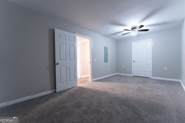 interior space with carpet, electric panel, and ceiling fan