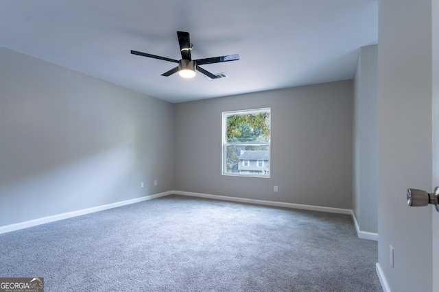 carpeted empty room with ceiling fan