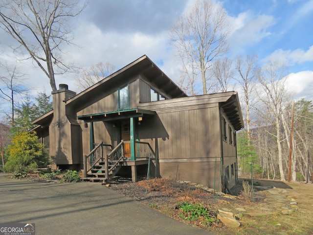 view of front facade with a chimney