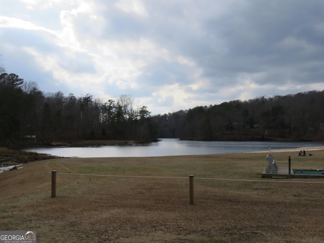 water view featuring a wooded view