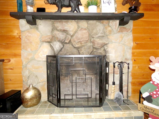 details with a stone fireplace