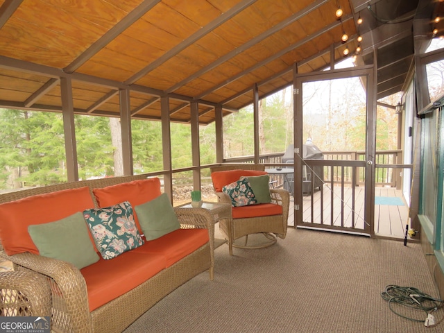 sunroom with wood ceiling and vaulted ceiling