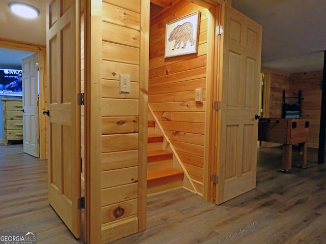 interior space with wood walls and wood finished floors