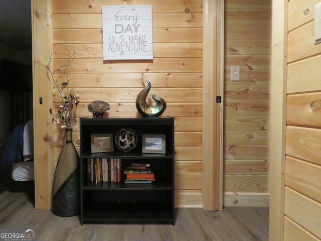 room details featuring wood walls and wood finished floors