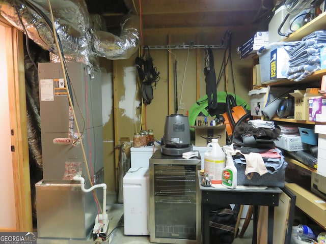 utility room featuring heating unit