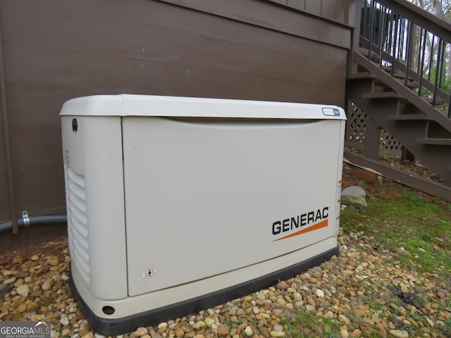 details featuring stairway, a power unit, and board and batten siding