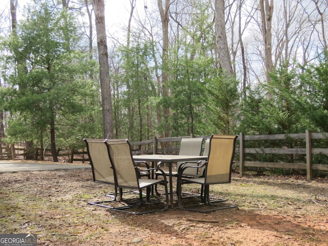 view of patio featuring fence