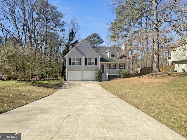 view of front of home featuring a garage, a front lawn, and a porch