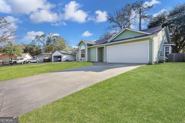 view of front of house featuring a garage and a front lawn