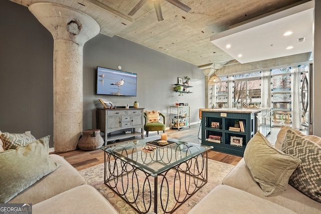 living area with light wood-style floors, visible vents, a ceiling fan, and recessed lighting