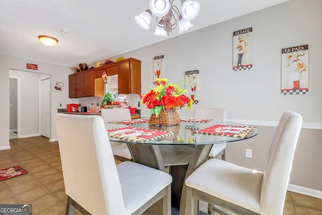 dining area featuring an inviting chandelier