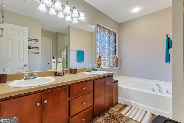 bathroom featuring a tub and vanity