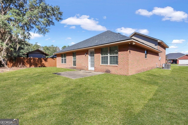 back of property featuring a patio, cooling unit, and a yard