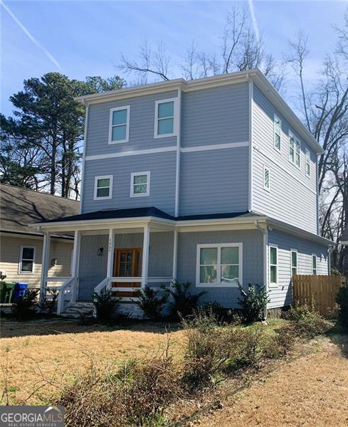 view of property featuring covered porch