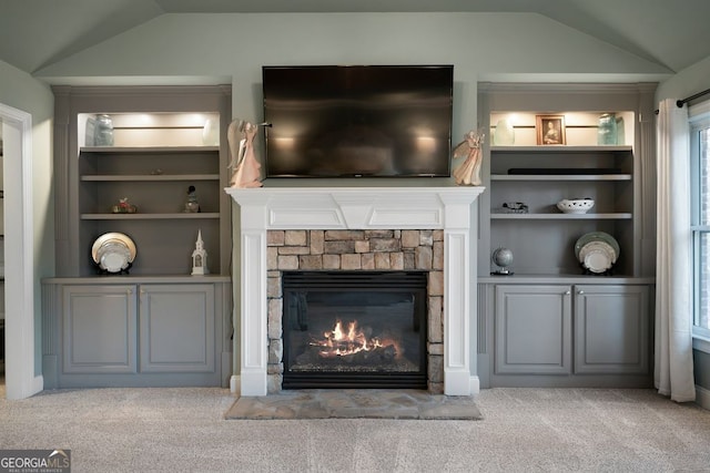 room details featuring carpet floors and a fireplace